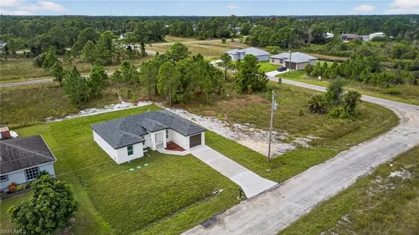 an aerial view of a house with outdoor space