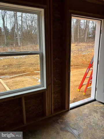 a view of a room that has a large window