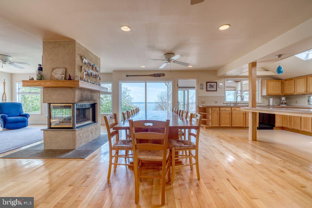 29 Center Road Earleville, MD 21919 - Photo 11 of 41 Dining area divided by free standing propane FP