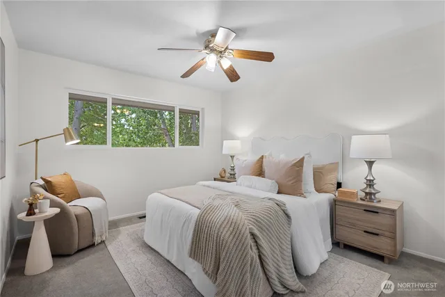 a bedroom with two beds and a chandelier