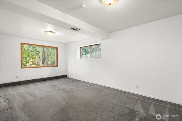 an aerial view of a house with a garden and trees