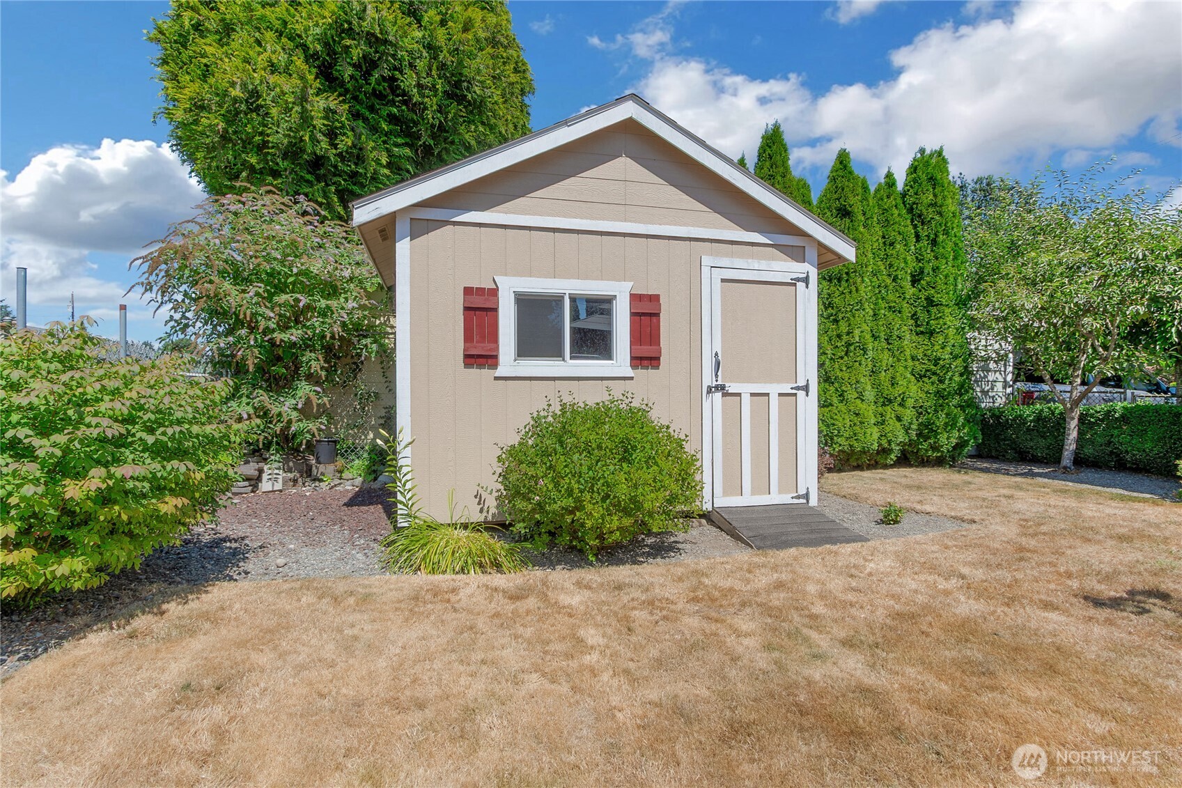 223 R Street Southeast Auburn, WA 98002 - Photo 21 of 23 a front view of a house with garden