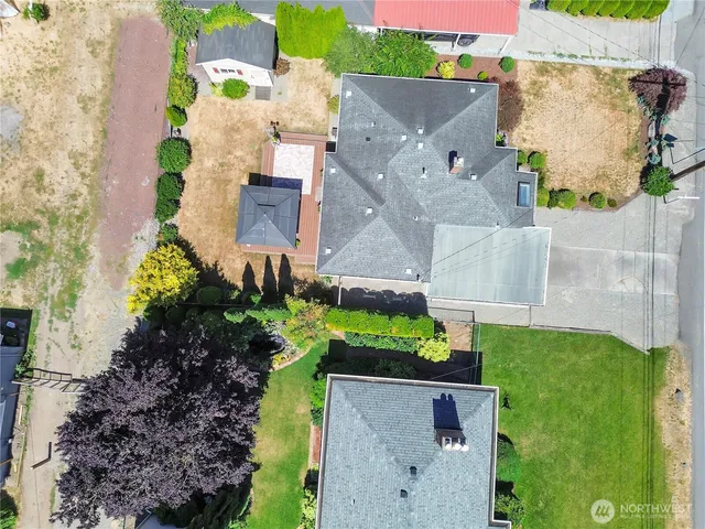 an aerial view of residential houses with outdoor space