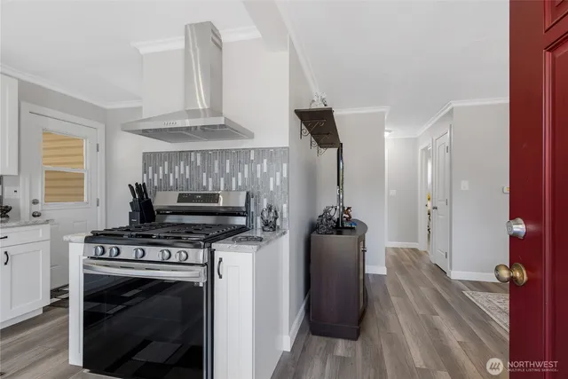 a kitchen with a stove and a refrigerator