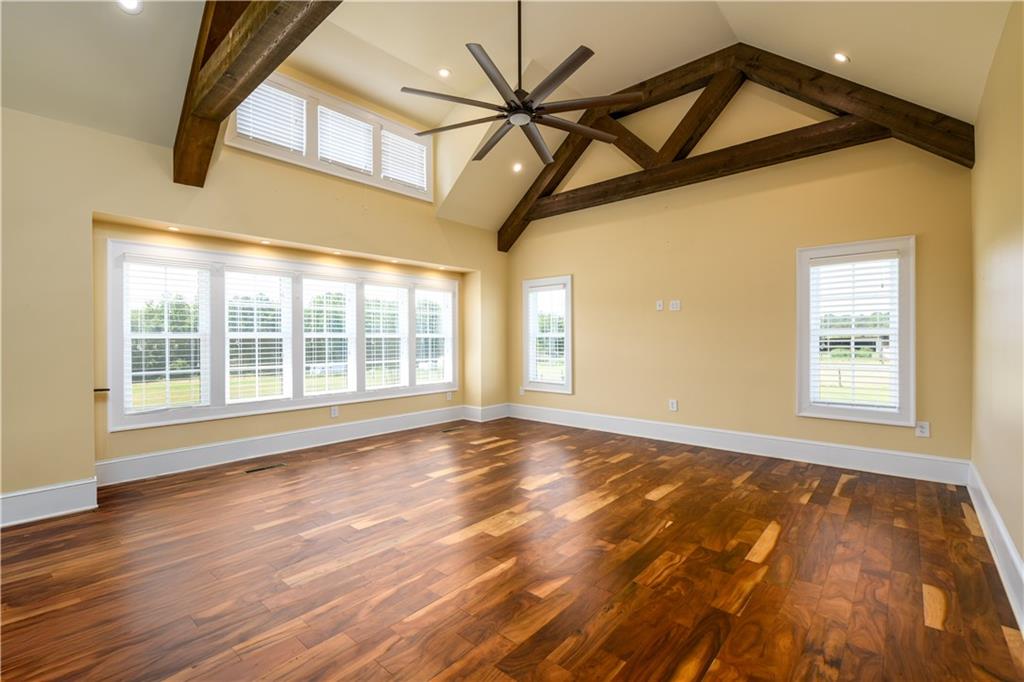 725 County Farm Road Jefferson, GA 30549 - Photo 12 of 43 a view of an empty room with wooden floor and a window