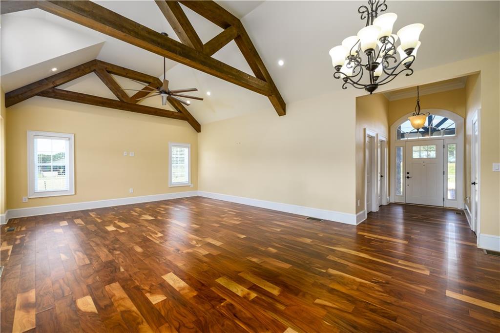 725 County Farm Road Jefferson, GA 30549 - Photo 13 of 43 a view of an empty room with a chandelier