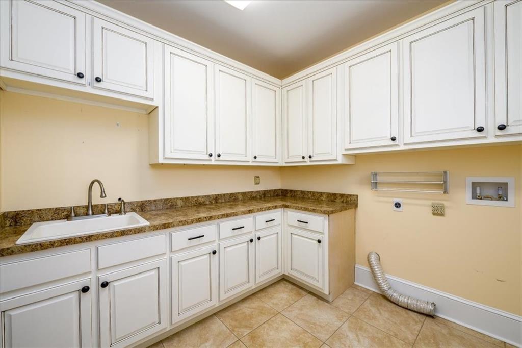 725 County Farm Road Jefferson, GA 30549 - Photo 19 of 43 a kitchen with granite countertop white cabinets and sink