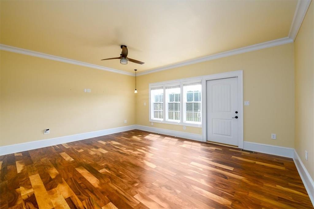 725 County Farm Road Jefferson, GA 30549 - Photo 20 of 43 a view of an empty room with wooden floor and a window
