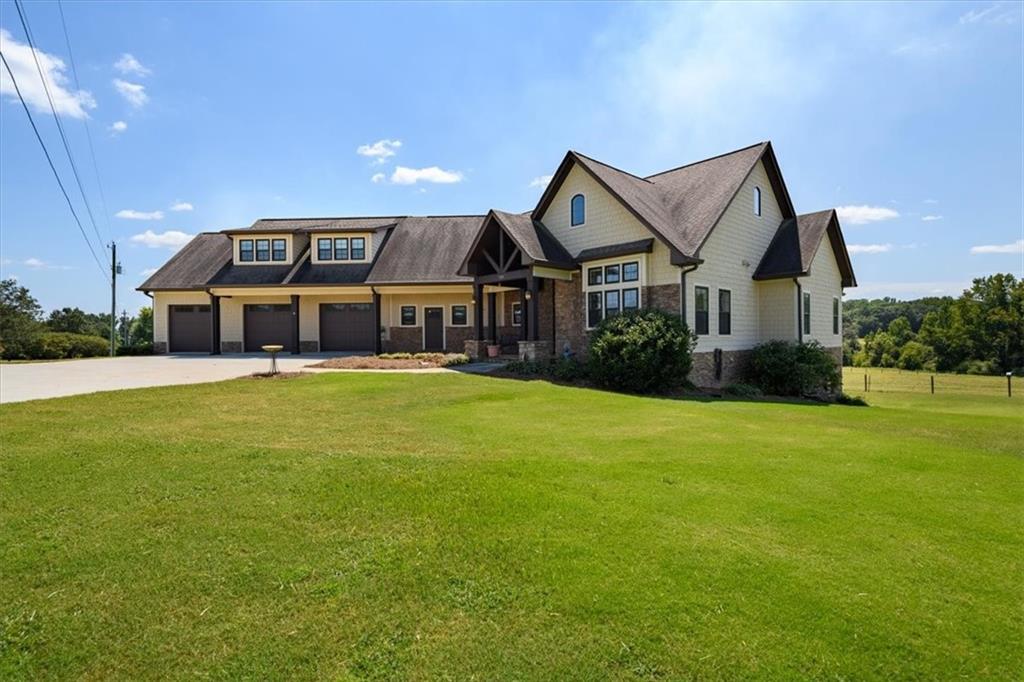 725 County Farm Road Jefferson, GA 30549 - Photo 2 of 43 a front view of a house with a big yard