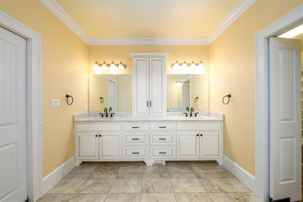 725 County Farm Road Jefferson, GA 30549 - Photo 22 of 43 a spacious bathroom with a granite countertop sink a mirror and a