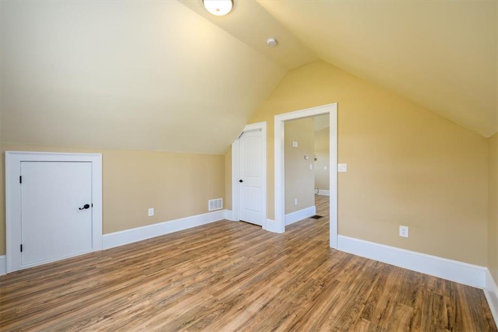 725 County Farm Road Jefferson, GA 30549 - Photo 28 of 43 a view of a big room with wooden floor and windows