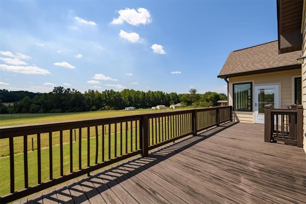 725 County Farm Road Jefferson, GA 30549 - Photo 35 of 43 a view of balcony with wooden floor and fence