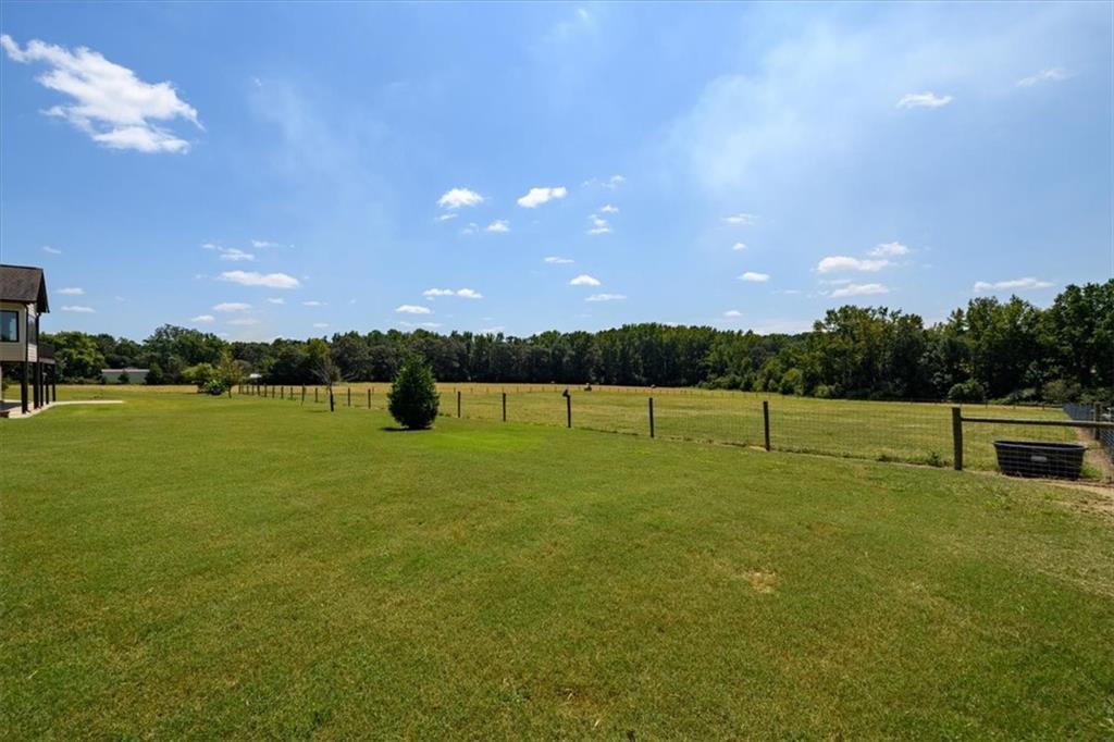 725 County Farm Road Jefferson, GA 30549 - Photo 39 of 43 a view of a golf course with a lake