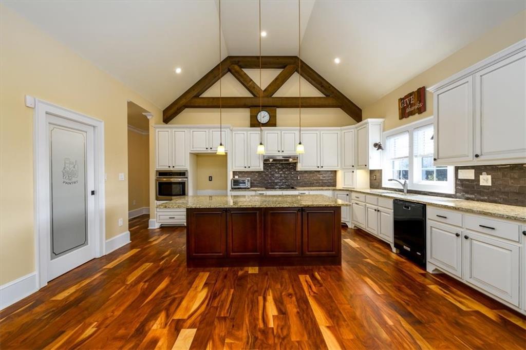 725 County Farm Road Jefferson, GA 30549 - Photo 7 of 43 a large kitchen with cabinets