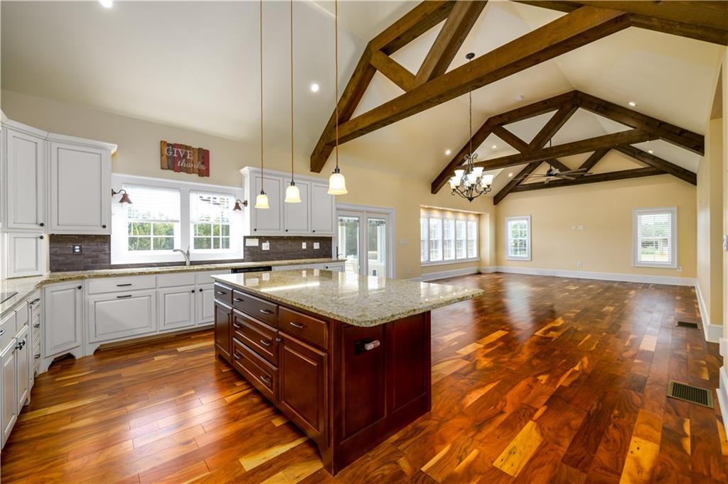 725 County Farm Road Jefferson, GA 30549 - Photo 9 of 43 a kitchen with a stove window and cabinets