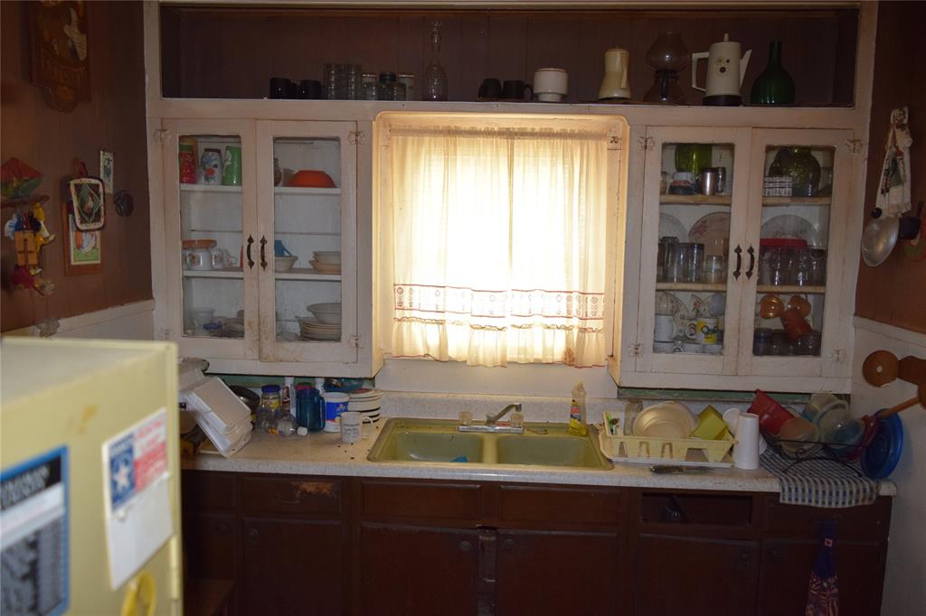 415 West 12th Street Coleman, TX 76834 - Photo 7 of 7 a bathroom with a sink and a window