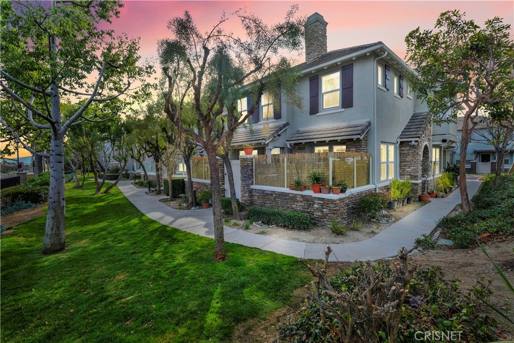 7737 Hess Place, Unit 1 Rancho Cucamonga, CA 91739 - Photo 1 of 1 a front view of a house with garden