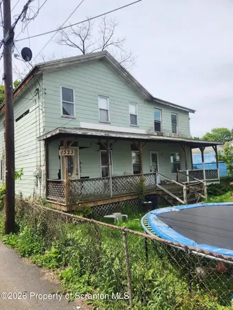 a front view of a house with garage