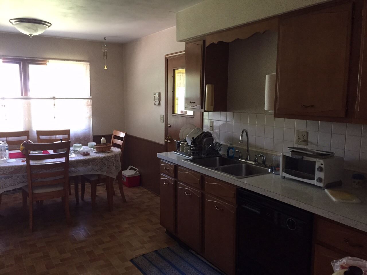 5206 Brookview Road Rockford, IL 61107 - Photo 13 of 23 a kitchen with a sink cabinets and dining table