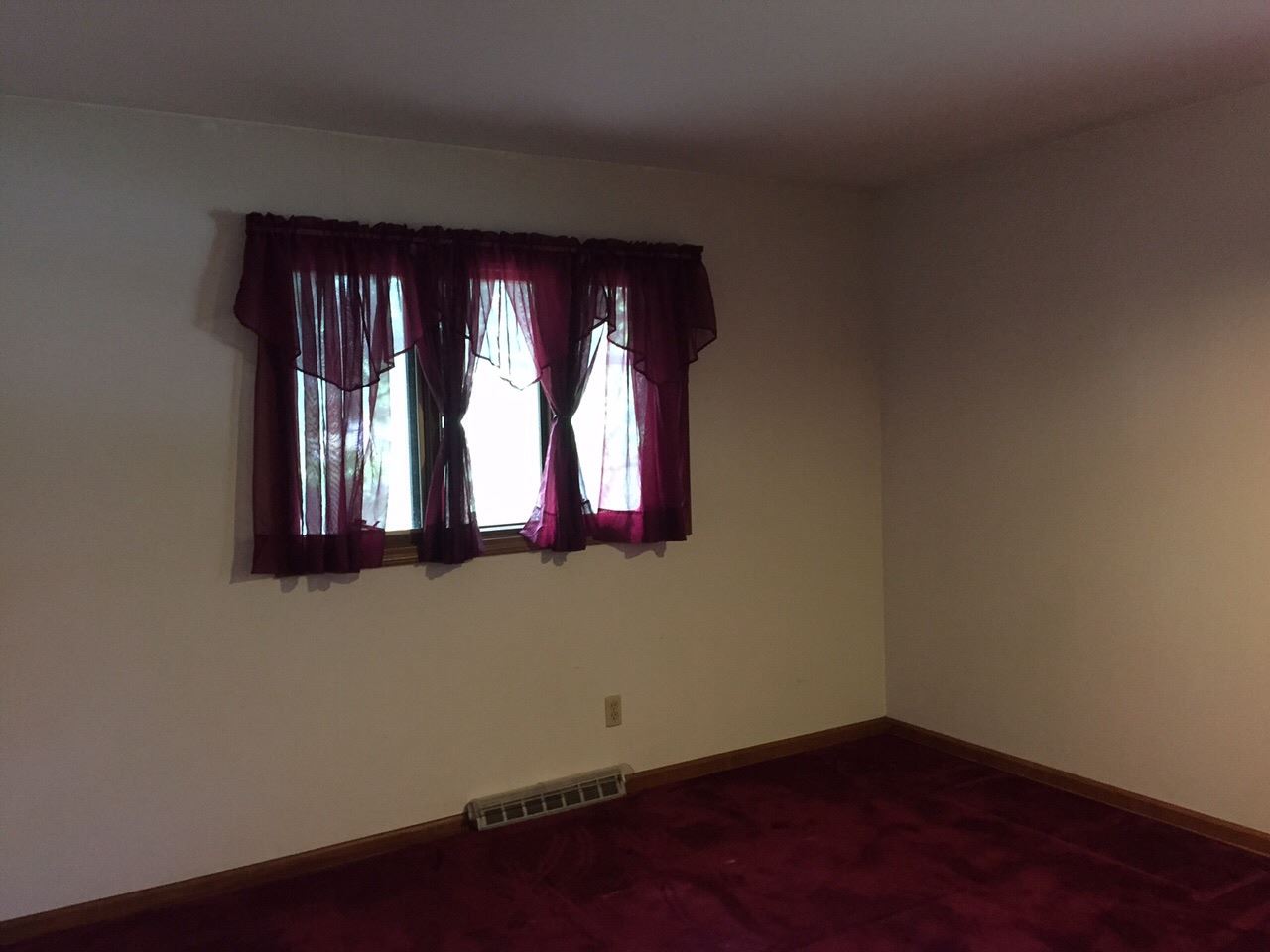 5206 Brookview Road Rockford, IL 61107 - Photo 8 of 23 an empty room with wooden floor and windows