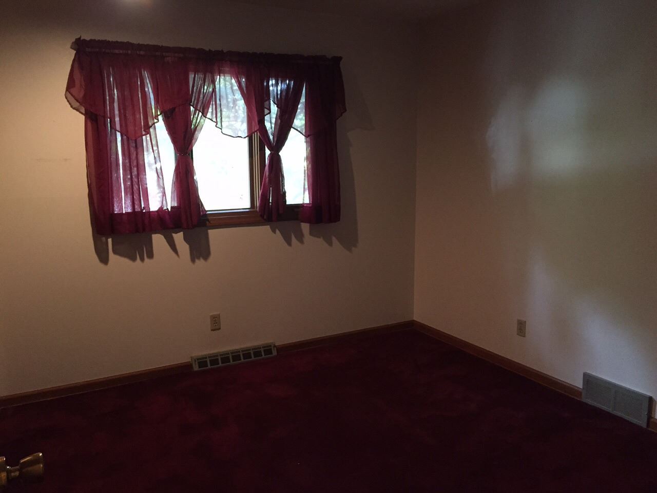 5206 Brookview Road Rockford, IL 61107 - Photo 9 of 23 a view of an empty room with wooden floor and a window