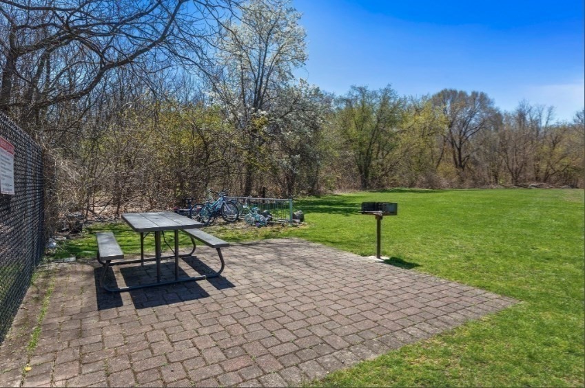 40 Westgate Road, Unit 5 Chestnut Hill, MA 02467 - Photo 31 of 33 a view of a bench in a garden