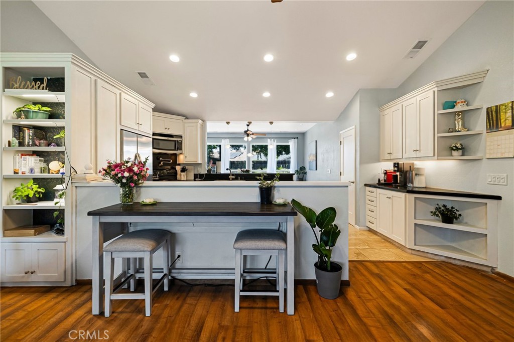 13 Avante Way Chico, CA 95973 - Photo 12 of 58 a living room with stainless steel appliances furniture wooden floor and a kitchen view