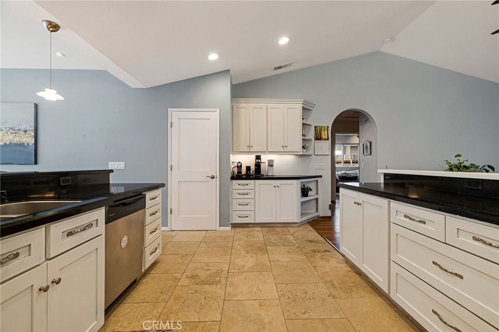 13 Avante Way Chico, CA 95973 - Photo 17 of 58 a large kitchen with stainless steel appliances a stove a sink and a refrigerator