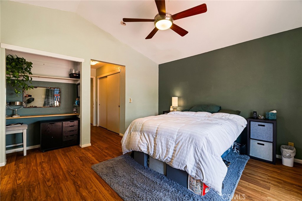 13 Avante Way Chico, CA 95973 - Photo 24 of 58 a bedroom with a bed and wooden floor