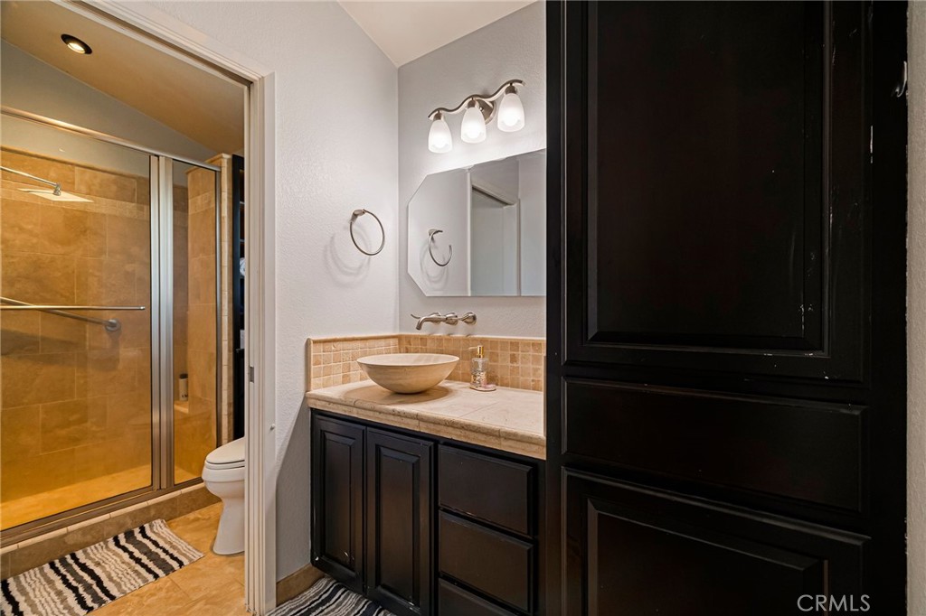 13 Avante Way Chico, CA 95973 - Photo 27 of 58 a bathroom with a sink a toilet and shower