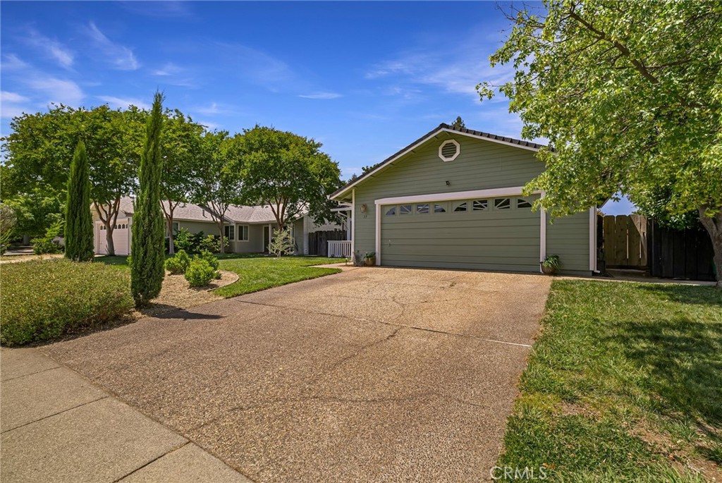 13 Avante Way Chico, CA 95973 - Photo 3 of 58 a front view of a house with a yard and garage