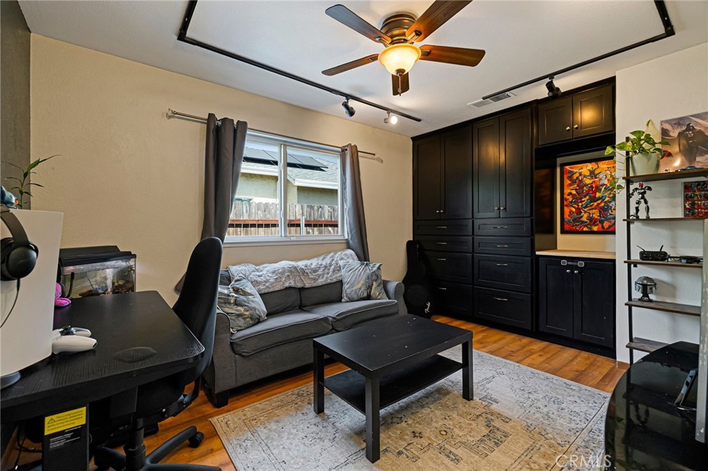 13 Avante Way Chico, CA 95973 - Photo 33 of 58 a living room with furniture and a flat screen tv