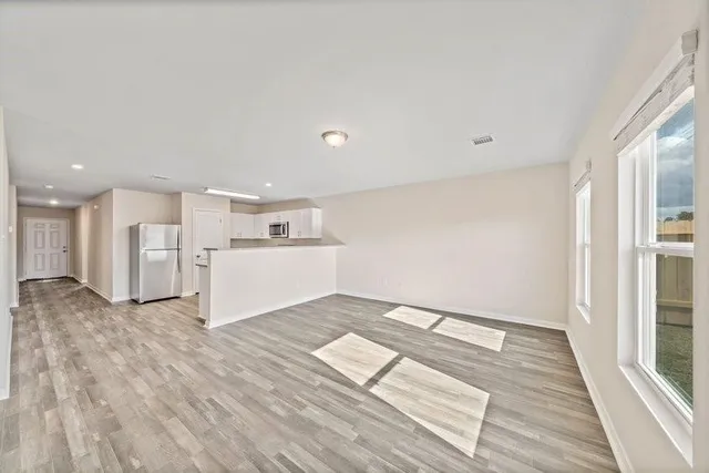 a view of a livingroom with wooden floor