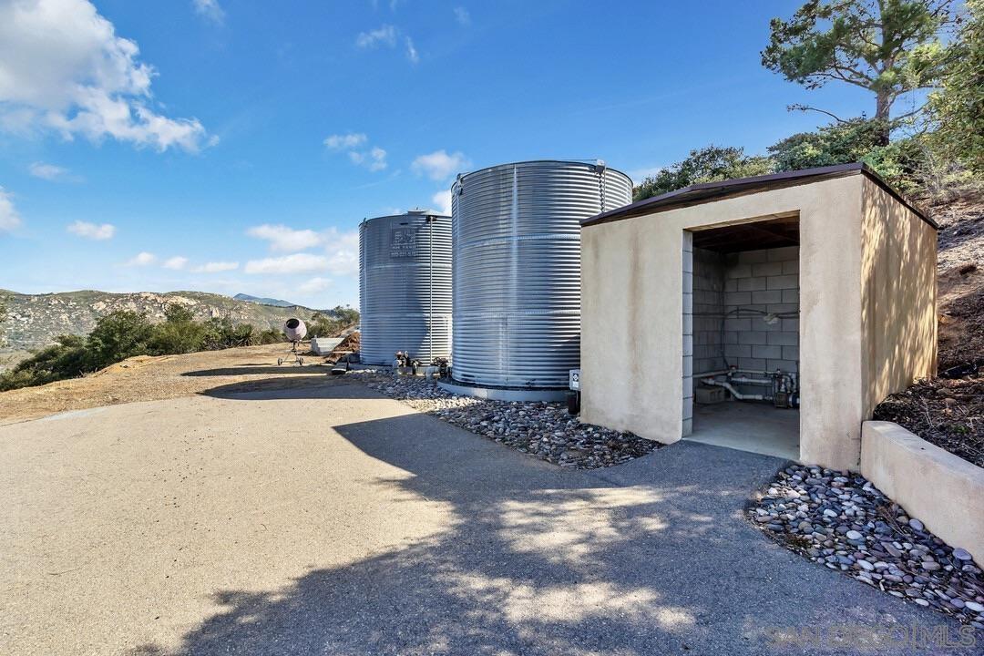 23611 Old Ranch Road Alpine, CA 91901 - Photo 21 of 25 a view of a street with a building in the background