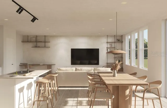 a dinning room with a table and chairs