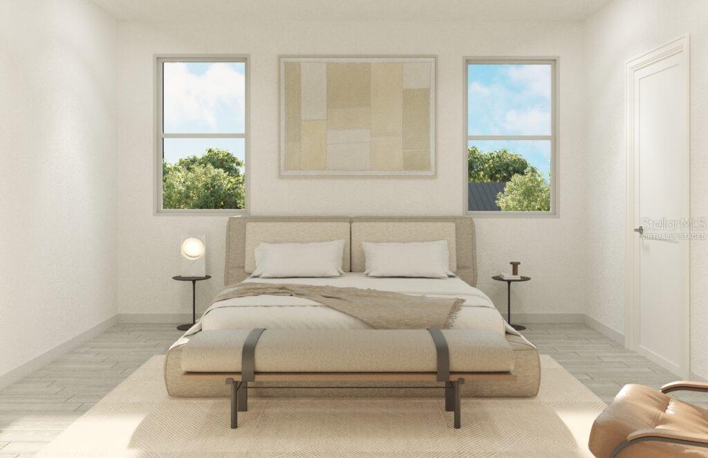 4480 Northwest 37th Street Road Ocala, FL 34482 - Photo 6 of 8 a bedroom with a bed lamps and a large window