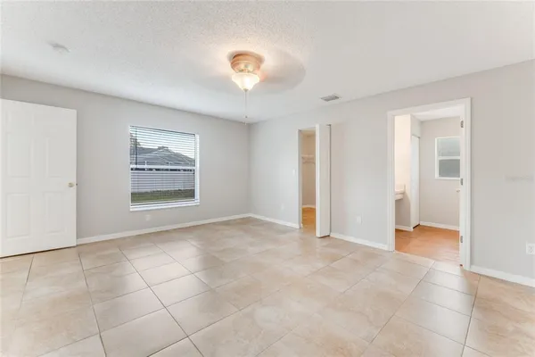 a view of an empty room with a window