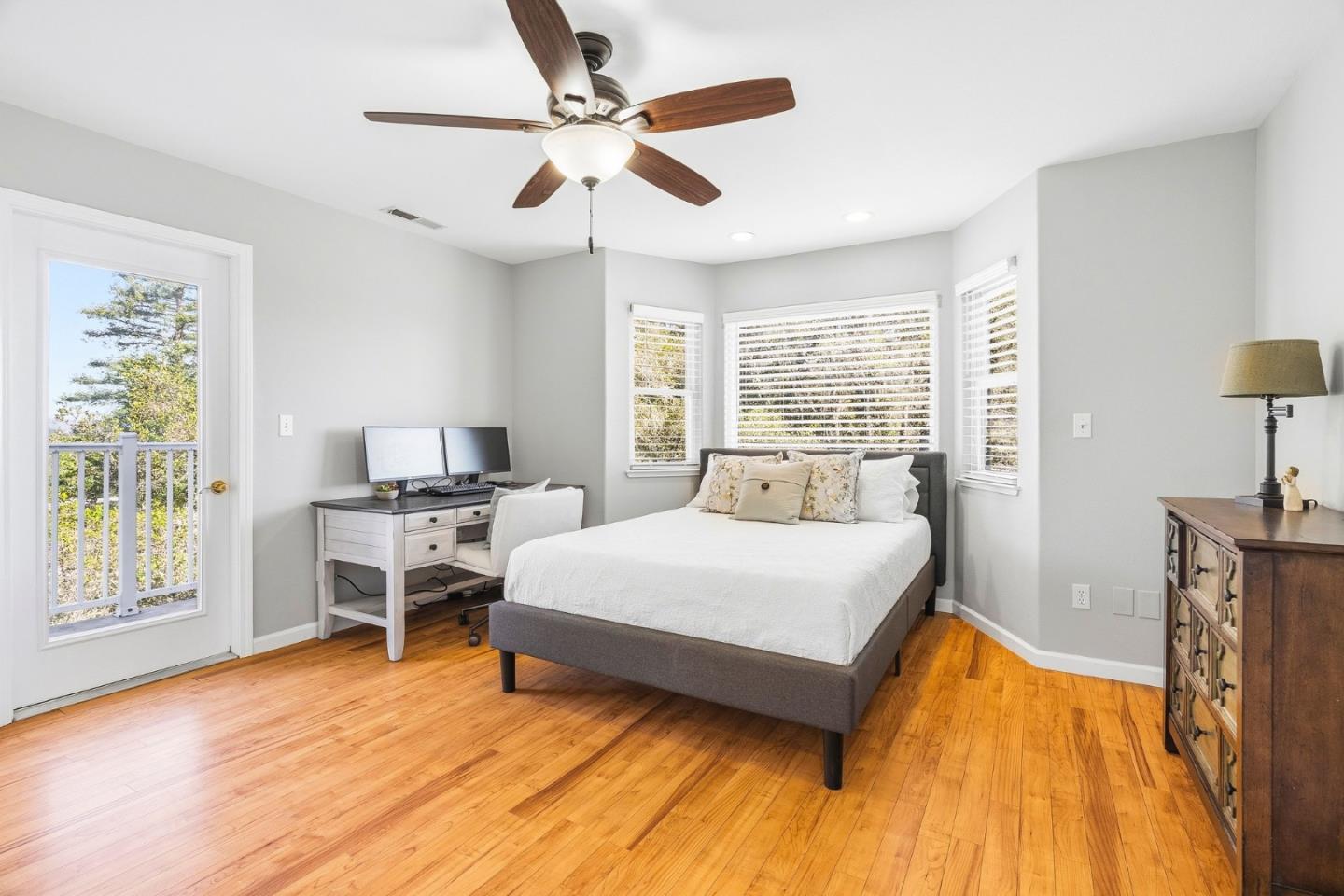 2500 Nelson Road Scotts Valley, CA 95066 - Photo 34 of 77 a spacious bedroom with a bed and a table in it with window