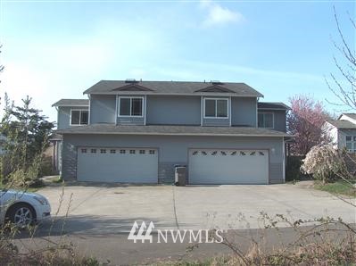 11929 Alexander Road, Unit A&B Everett, WA 98204 - Photo 1 of 1 a front view of a house with a garage