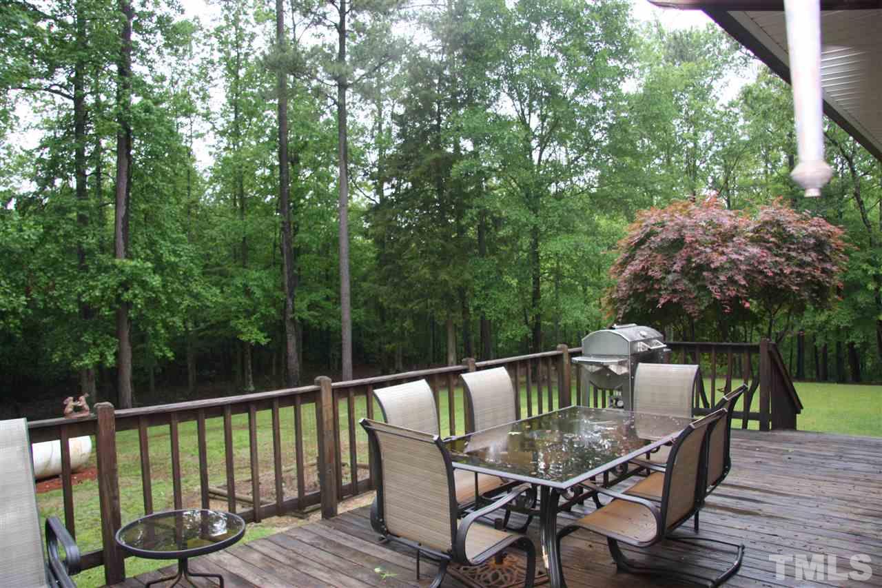 1825 Rc Watson Road Wendell, NC 27591 - Photo 15 of 18 a view of a deck with furniture and a backyard