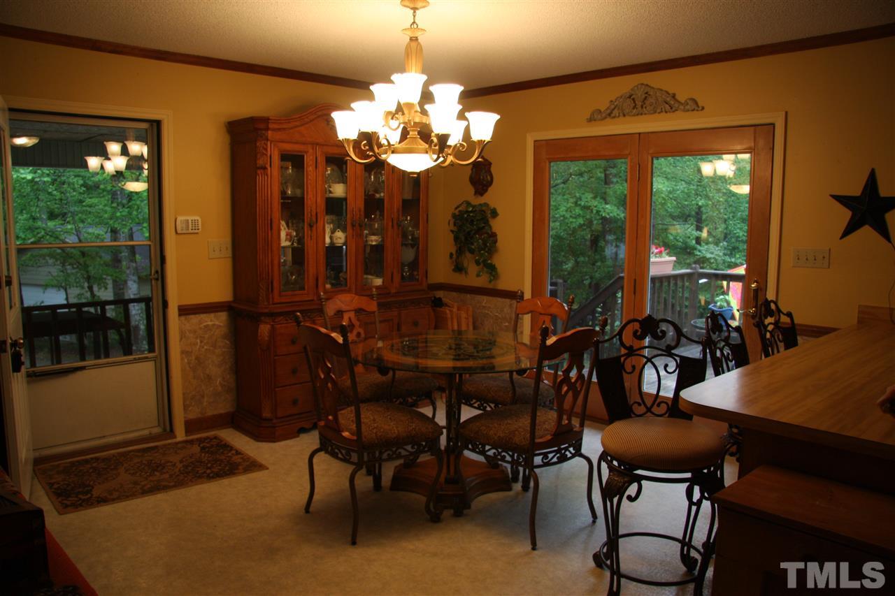 1825 Rc Watson Road Wendell, NC 27591 - Photo 4 of 18 a view of a dining room with furniture and chandelier
