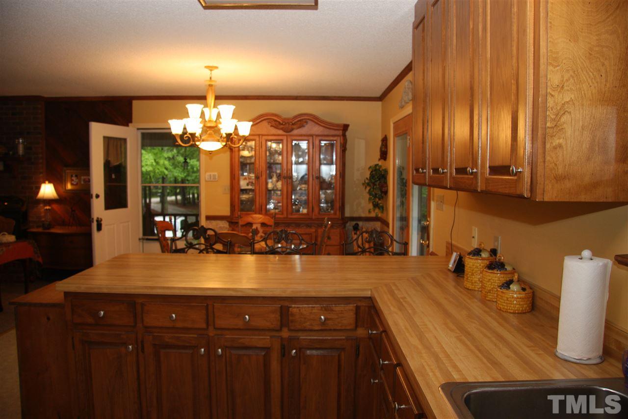 1825 Rc Watson Road Wendell, NC 27591 - Photo 7 of 18 a kitchen with a sink and cabinets