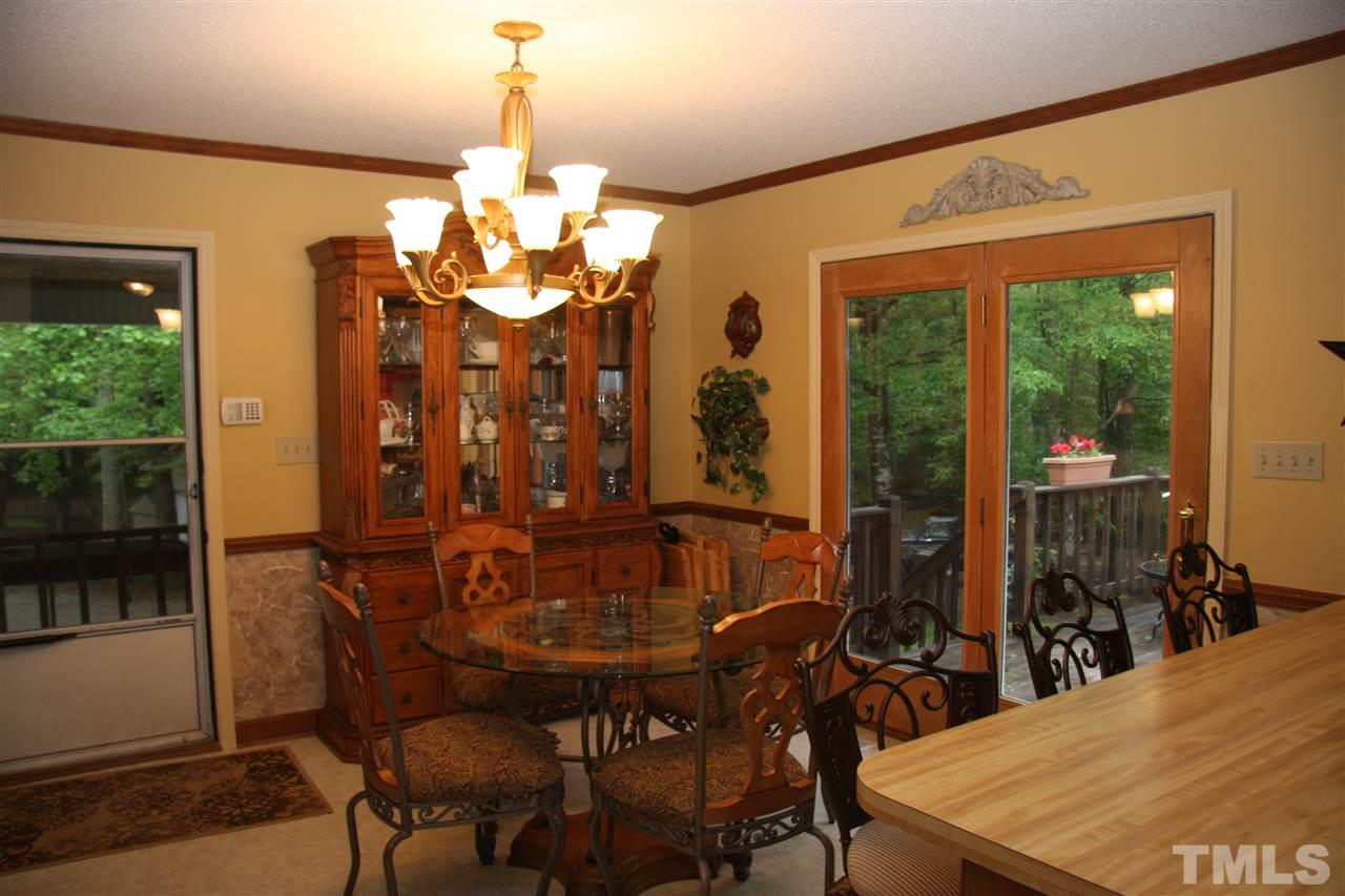 1825 Rc Watson Road Wendell, NC 27591 - Photo 8 of 18 a view of a dining room with furniture and chandelier