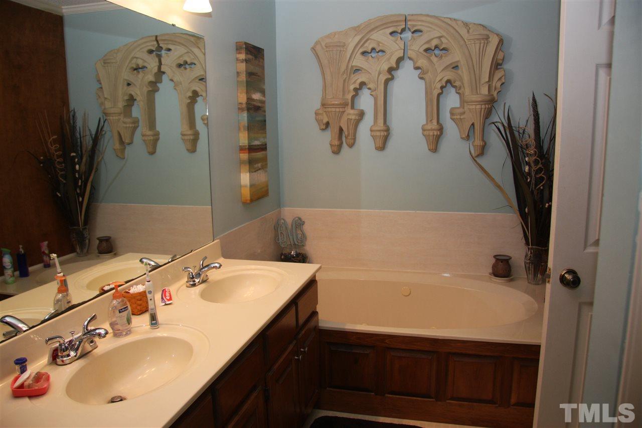 1825 Rc Watson Road Wendell, NC 27591 - Photo 10 of 18 a bathroom with a bathtub and a sink