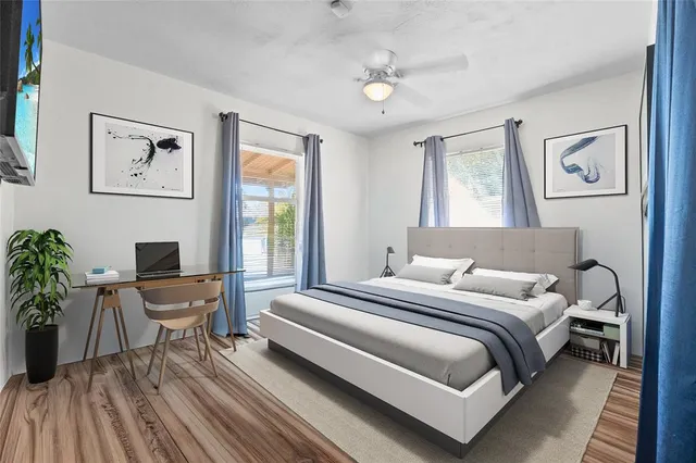 a bedroom with a bed and a chair