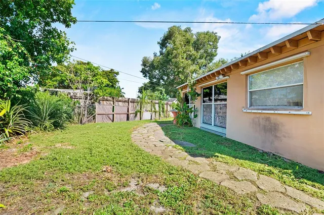 a view of backyard with green space