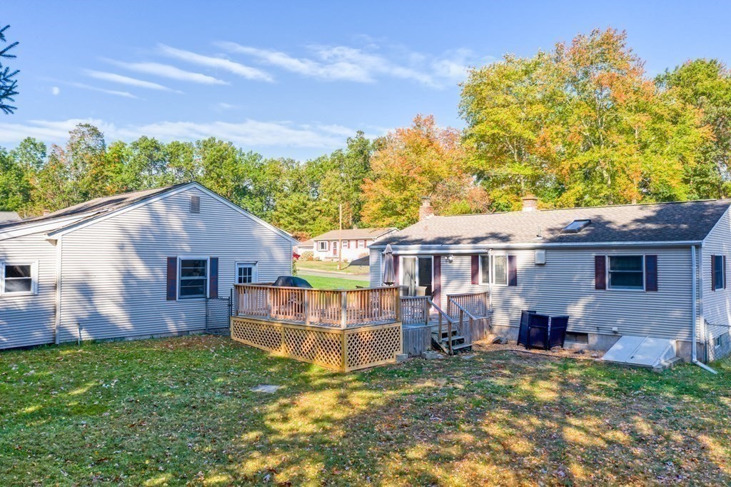 59 Corey Road Springfield, MA 01128 - Photo 18 of 22 a view of a house with a yard and plants