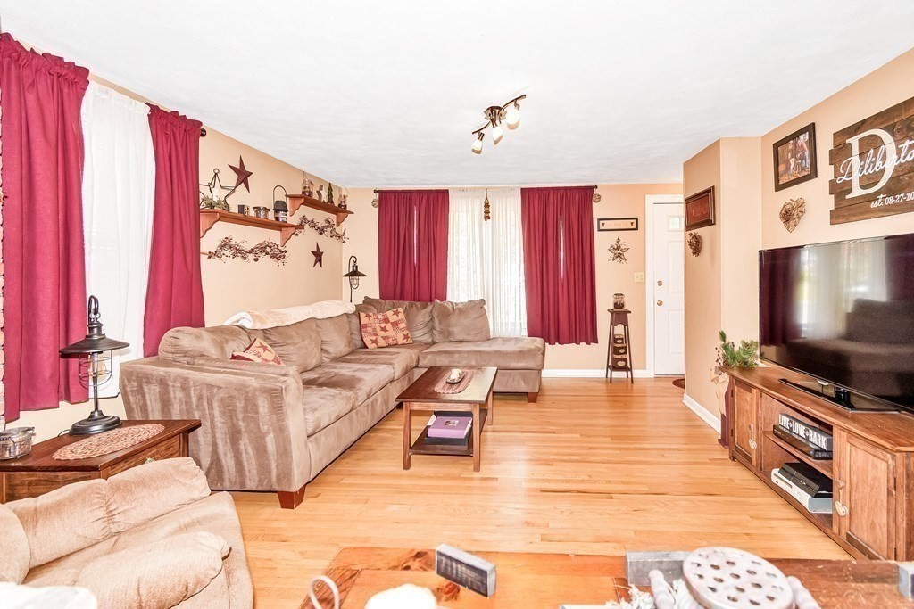 59 Corey Road Springfield, MA 01128 - Photo 5 of 22 a living room with furniture and a flat screen tv