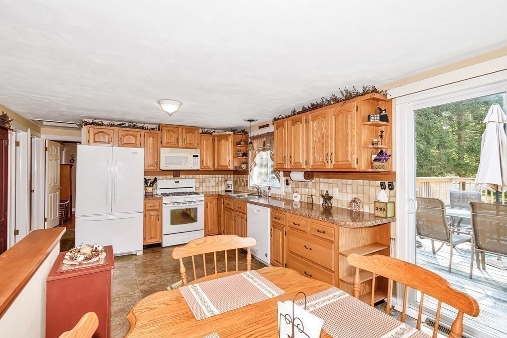 59 Corey Road Springfield, MA 01128 - Photo 6 of 22 a living room with stainless steel appliances granite countertop furniture and a large window