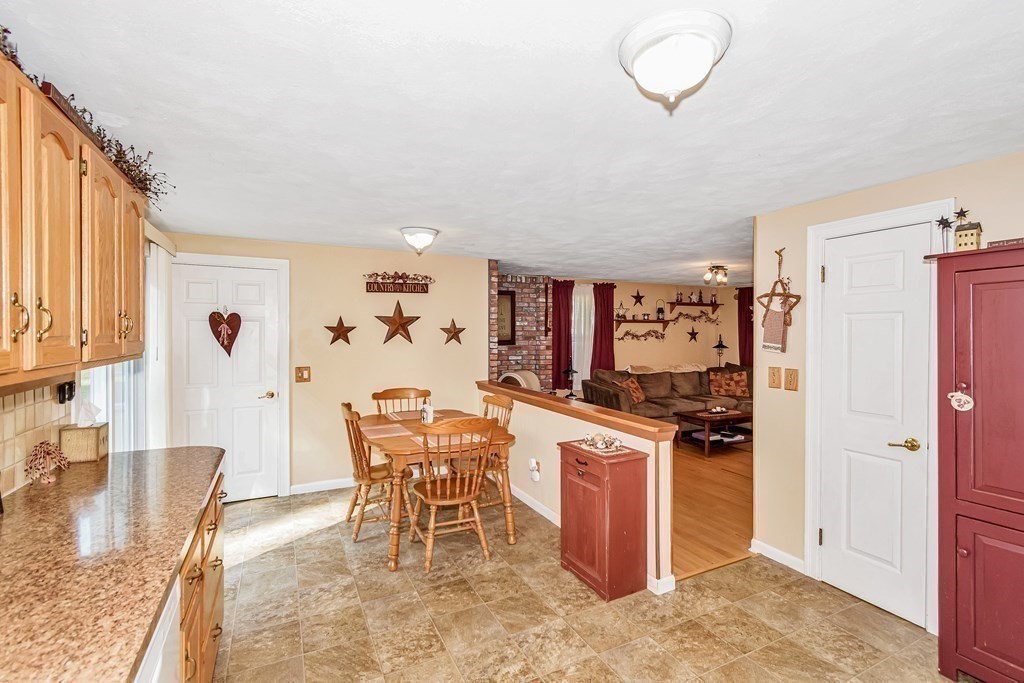 59 Corey Road Springfield, MA 01128 - Photo 8 of 22 a kitchen with stainless steel appliances granite countertop a stove and a refrigerator